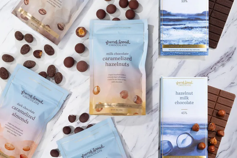 French Broad Chocolate bars and bonbon bags on a marble counter