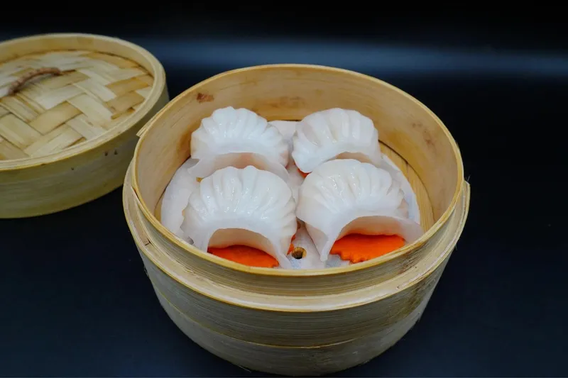 Bamboo steamer of shrimp har gow crystal dumplings at Silk Road