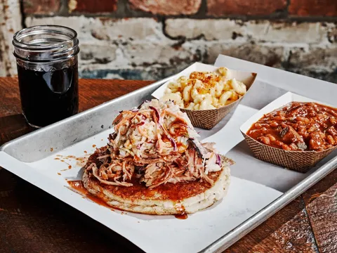 Pulled pork sandwich with coleslaw, mac and cheese, and baked beans at Martin's Bar-B-Que Joint