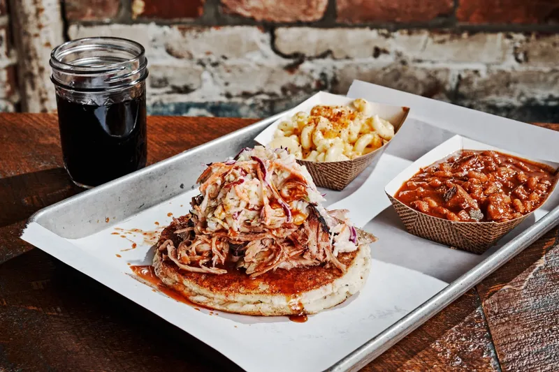Pulled pork sandwich with coleslaw, mac and cheese, and baked beans at Martin's Bar-B-Que Joint