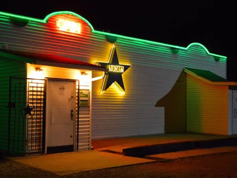 North Star Steakhouse's neon sign lit up at night