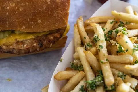 Red's Java House veggie cheeseburger beside garlic fries