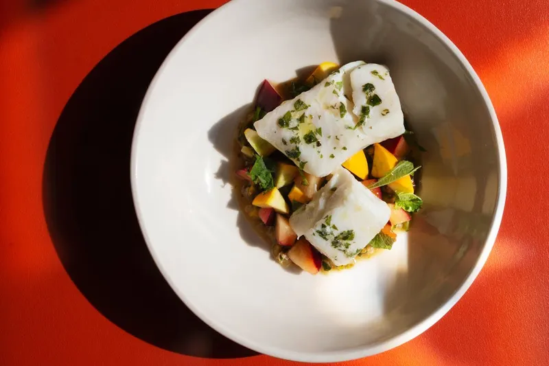 Seasonal fish entrée with vegetables at Lula Cafe