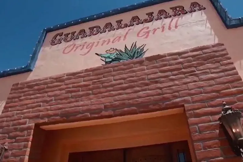 Brick-and-adobe storefront of Guadalajara Original Grill's Oracle Road location in Tucson, with 'GUADALAJARA Original Grill' painted on the stucco facade under a blue sky