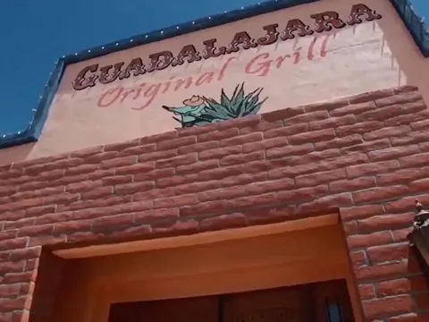 Brick-and-adobe storefront of Guadalajara Original Grill's Oracle Road location in Tucson, with 'GUADALAJARA Original Grill' painted on the stucco facade under a blue sky
