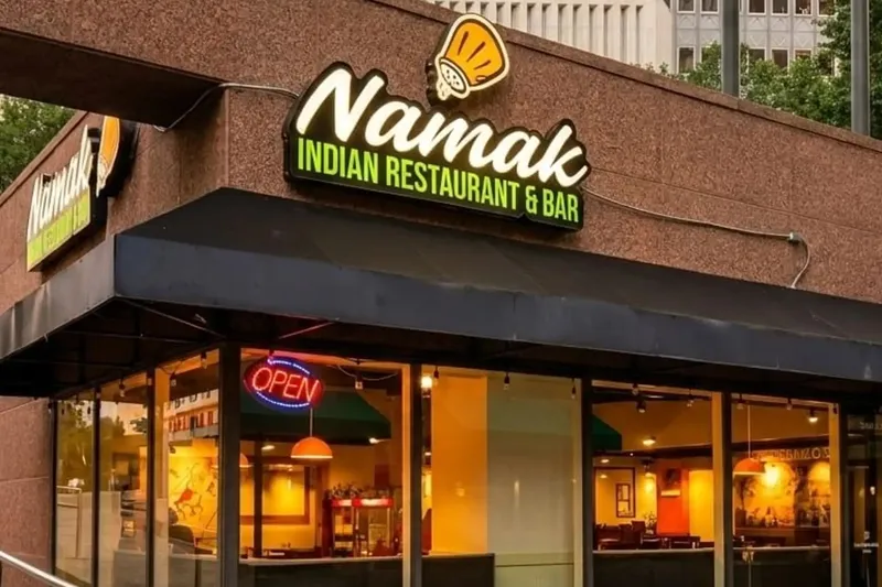 Storefront sign and entrance for Namak Indian Cuisine in Dallas.