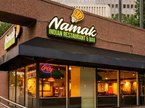 Storefront sign and entrance for Namak Indian Cuisine in Dallas.