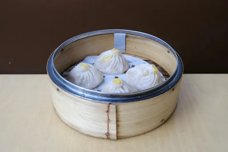 Bamboo steamer of soup dumplings (xiao long bao) at Birds of a Feather