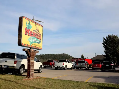 Roadside sign and parking lot at Mexico Tipico in Rapid City