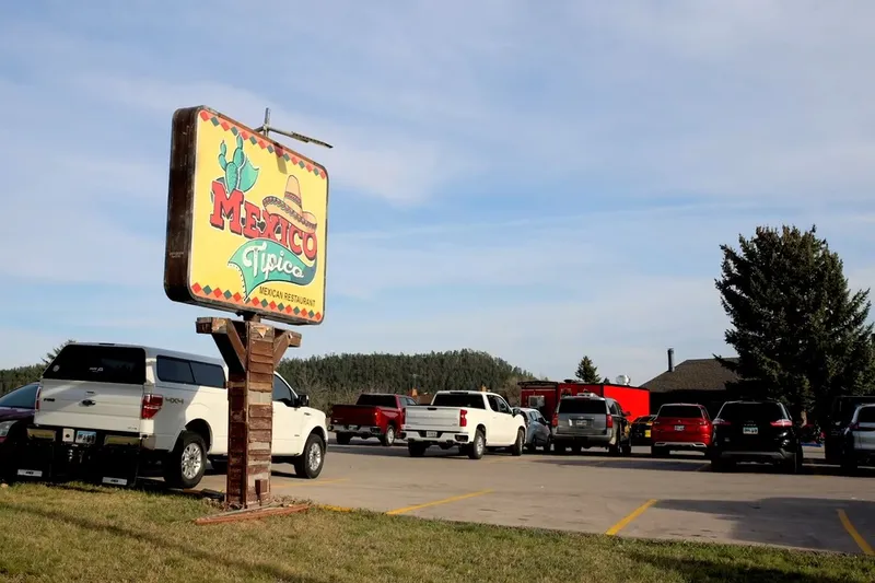 Roadside sign and parking lot at Mexico Tipico in Rapid City