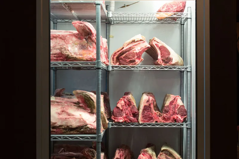 Dry-aging cabinet of steaks at Porterhouse