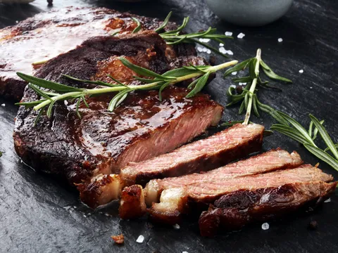 Sliced steak with rosemary at Over The Moon Cafe