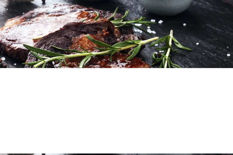 Sliced steak with rosemary at Over The Moon Cafe
