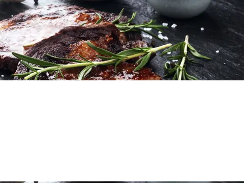 Sliced steak with rosemary at Over The Moon Cafe