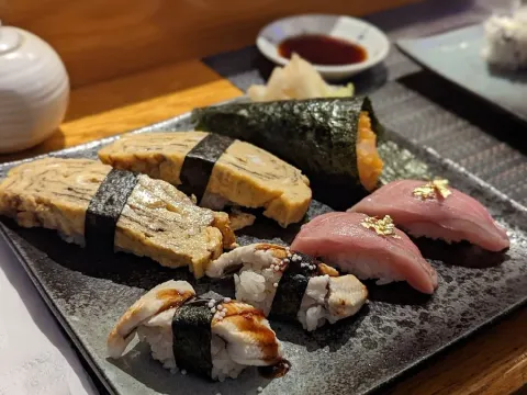 Assorted nigiri and sushi rolls at Higuma